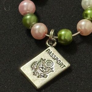 Wine glass tag, stainless steel hoop, green/pink beads, passport charm